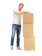 Image showing handsome man with big boxes