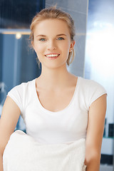 Image showing smiling teenage girl with towels