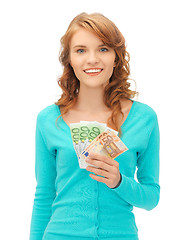 Image showing happy teenage girl with euro cash money