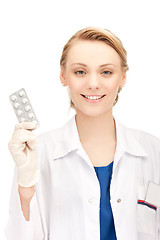 Image showing attractive female doctor with pills