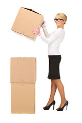 Image showing businesswoman with big boxes