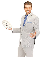 Image showing handsome man with clock