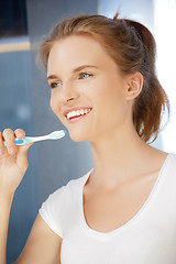 Image showing smiling teenage girl with toothbrush