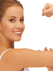 Image showing sporty woman flexing her biceps