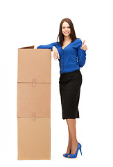 Image showing businesswoman with big boxes