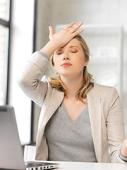 Image showing stressed woman with laptop computer