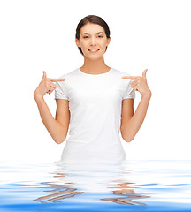 Image showing happy and carefree teenage girl in water