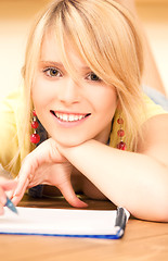 Image showing teenage girl with notebook and pen