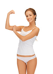 Image showing woman in cotton undrewear flexing her biceps