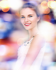 Image showing happy and smiling teenage girl with city lights