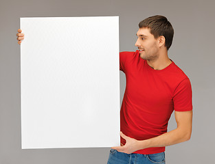 Image showing handsome man with big blank board