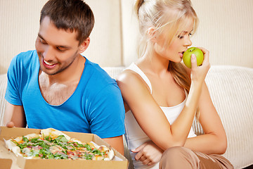 Image showing couple eating different food