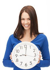 Image showing woman holding big clock