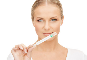 Image showing female doctor with thermometer