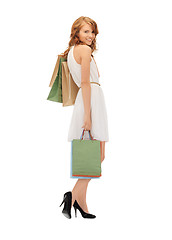 Image showing happy teenage girl with shopping bags