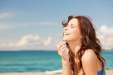 Image showing laughing woman on the beach