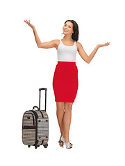 Image showing happy woman with suitcase greeting
