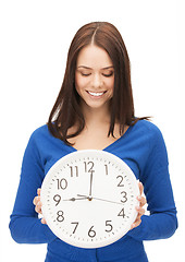 Image showing woman holding big clock