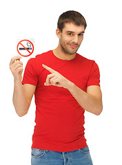 Image showing man in red shirt with no smoking sign