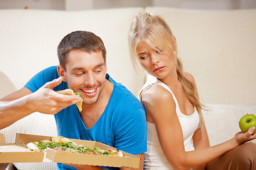 Image showing couple eating different food