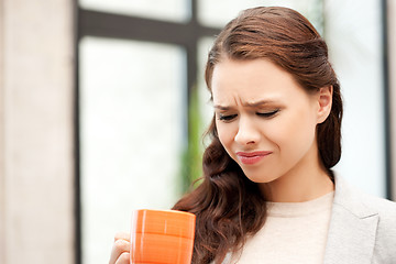 Image showing lovely businesswoman with mug