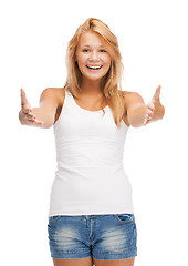 Image showing smiling teenage girl in blank white t-shirt