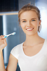 Image showing smiling teenage girl with toothbrush