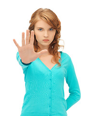 Image showing young woman making stop gesture