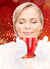 Image showing beautiful woman with red mug