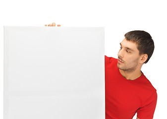 Image showing handsome man with big blank board