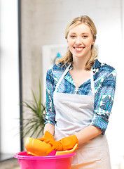 Image showing housewife washing dish at the kitchen