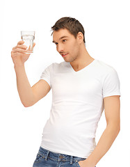 Image showing man in white shirt with glass of water