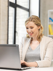 Image showing happy woman with laptop computer