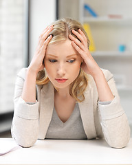 Image showing unhappy woman in office