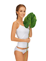 Image showing lovely woman with green leaf