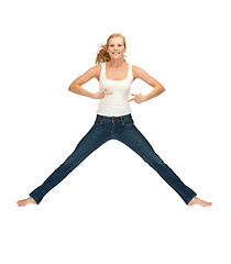 Image showing jumping teenage girl in blank white t-shirt