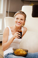 Image showing smiling teenage girl with chips and coke