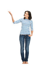 Image showing woman in casual clothes showing direction