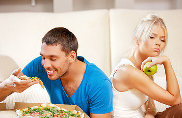 Image showing couple eating different food