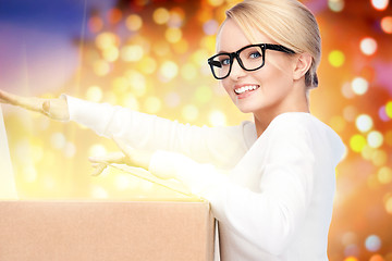 Image showing attractive businesswoman with cardboard box