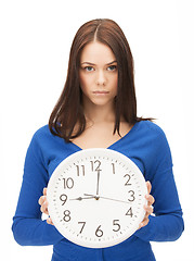 Image showing woman holding big clock