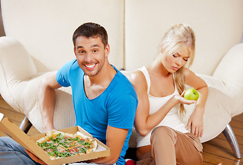 Image showing couple eating different food