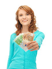 Image showing happy teenage girl with euro cash money