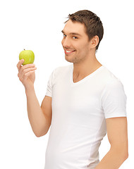 Image showing man in white shirt with green apple
