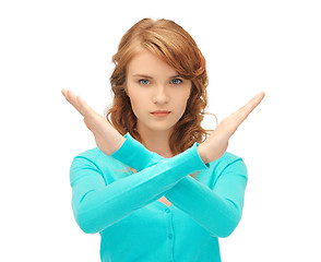 Image showing young woman making stop gesture