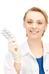 Image showing attractive female doctor with pills