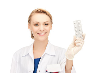 Image showing attractive female doctor with pills