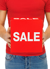 Image showing man's hands holding sale sign