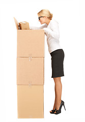 Image showing businesswoman with big boxes