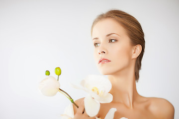 Image showing lovely woman with orchid flower